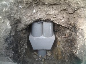 Press pier and cap block with shims - slab repair